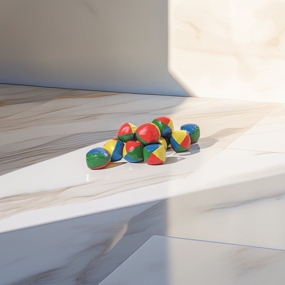Colorful set of 12 soft juggling balls for beginners, featuring vibrant red, blue, yellow, and green hues, ideal for learning and fun.