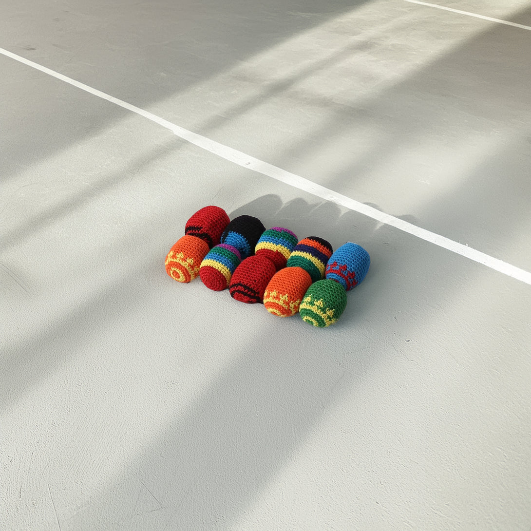 Colorful set of 10 hand-crocheted juggling and stress-relief balls, each with unique ethnic or multicolored patterns.
