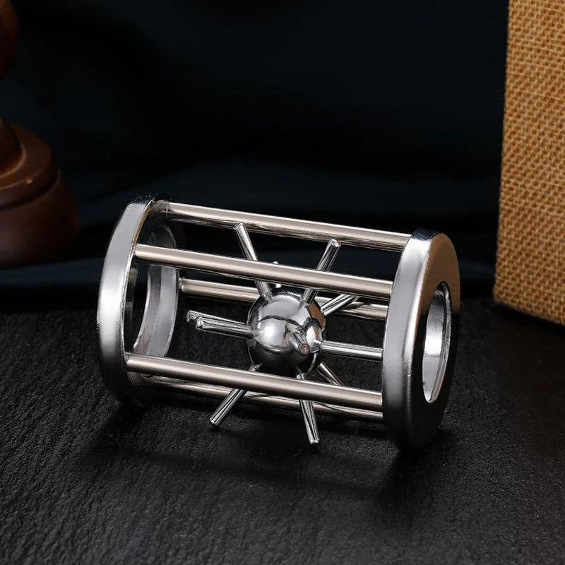 Sleek metal puzzle featuring a captivating sphere trapped in a cylindrical cage of rods, blending industrial design with brain-teasing fun.