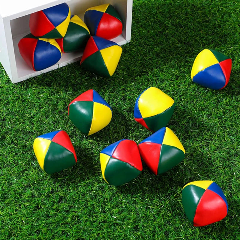 Colorful set of 12 soft juggling balls in red, blue, yellow, and green, with a slightly cubic shape for easy handling.